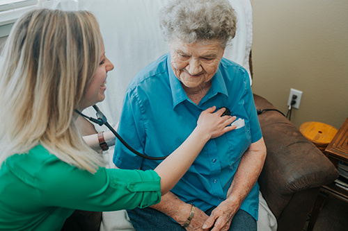 Female nurse with older female woman