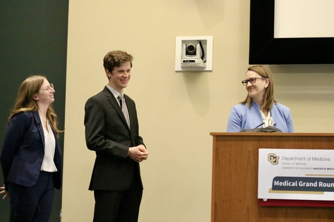 From left to right: Lynne Rosenberg, MD; Evan Zehr, MD; and Samantha Thielen, MD, smile during their presentation.