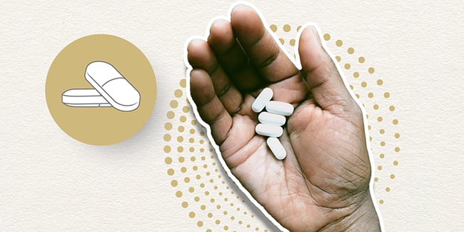 Multiple Acetaminophen pills in palm of hand