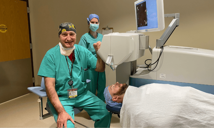 Michael Taravella, MD, far left, working.