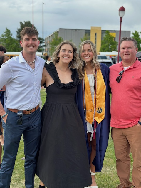 Emily Benton smiling with her family.