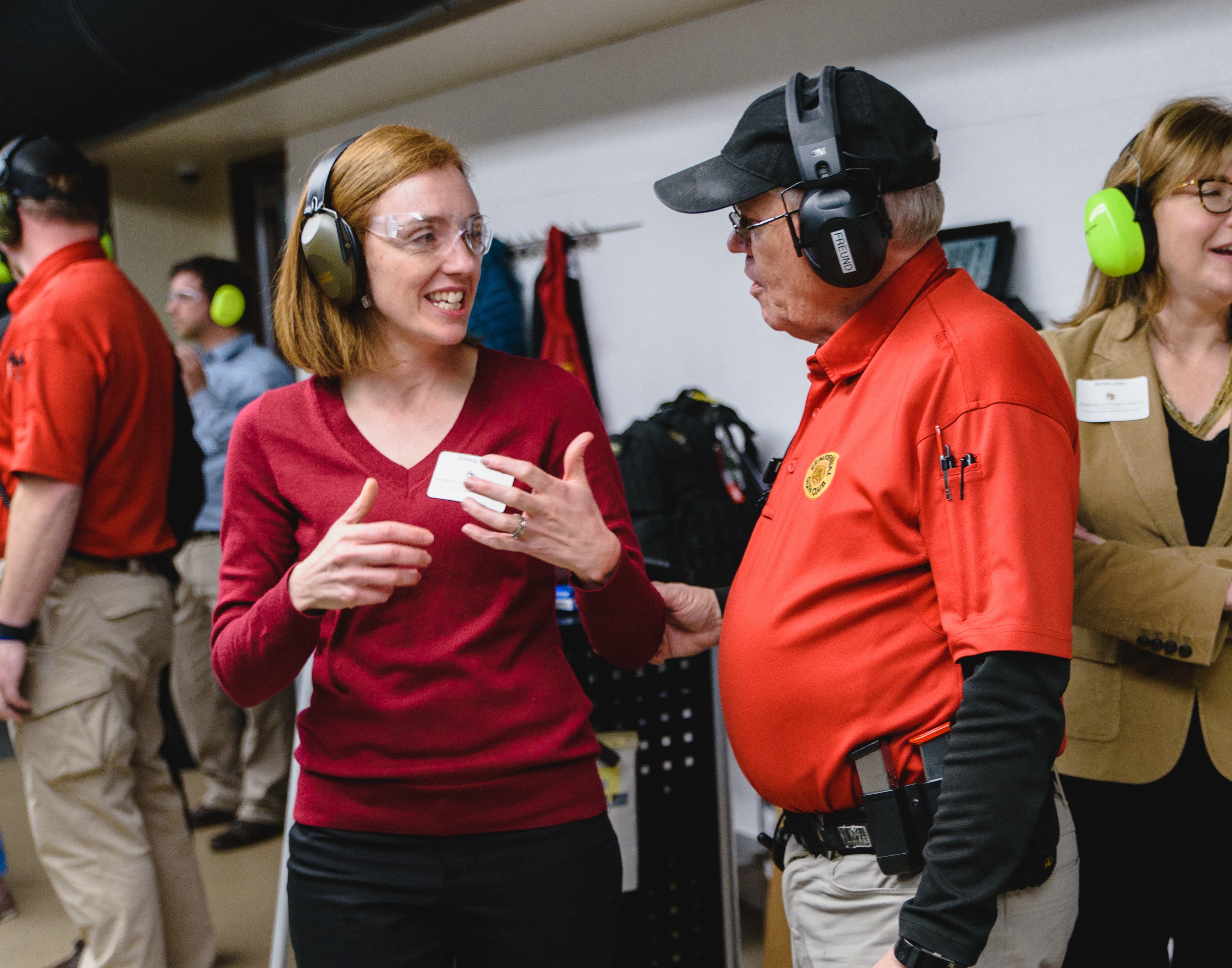 Betz speaking with a gun club representative