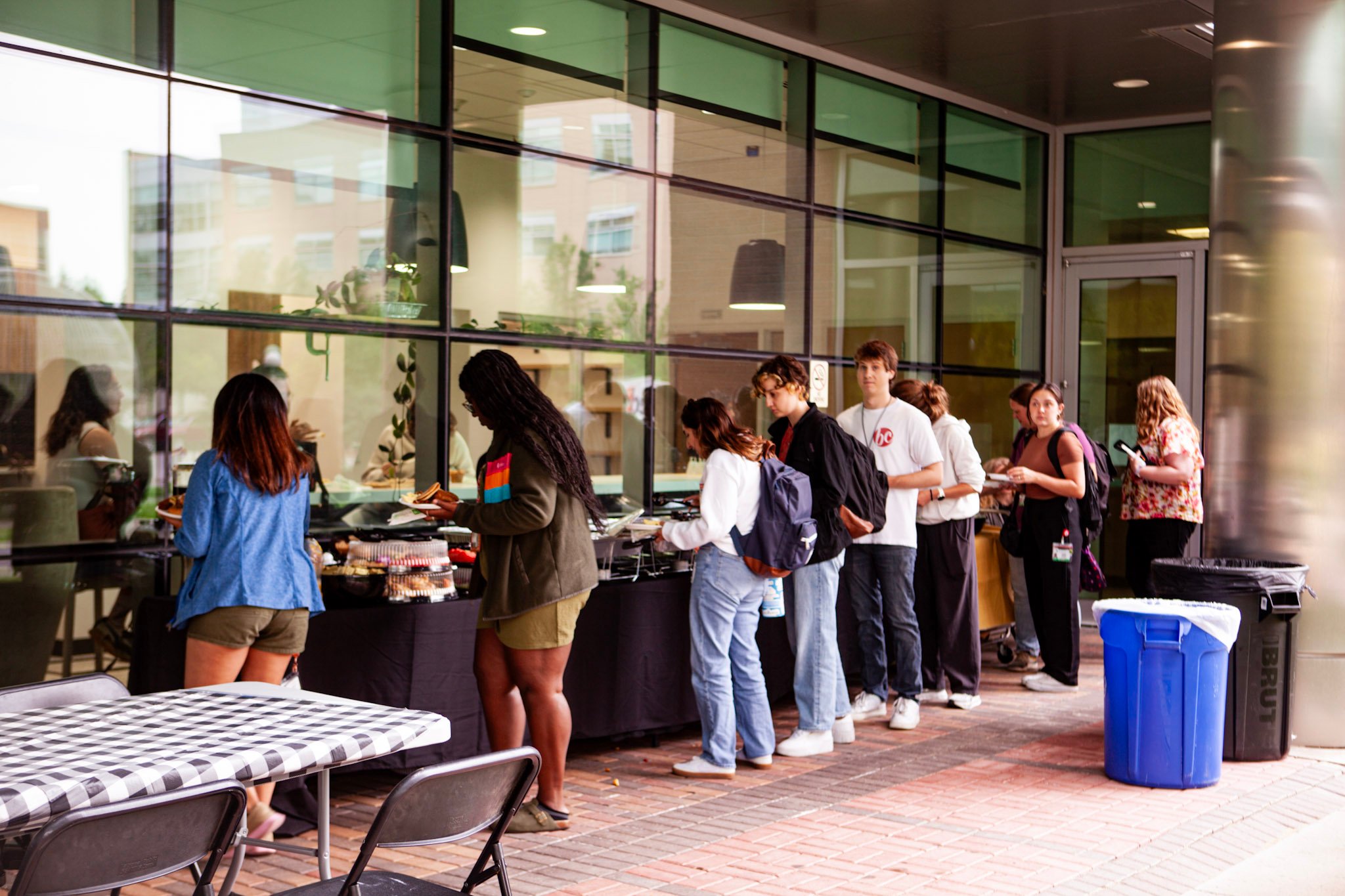 Attendees go through the Griddle line