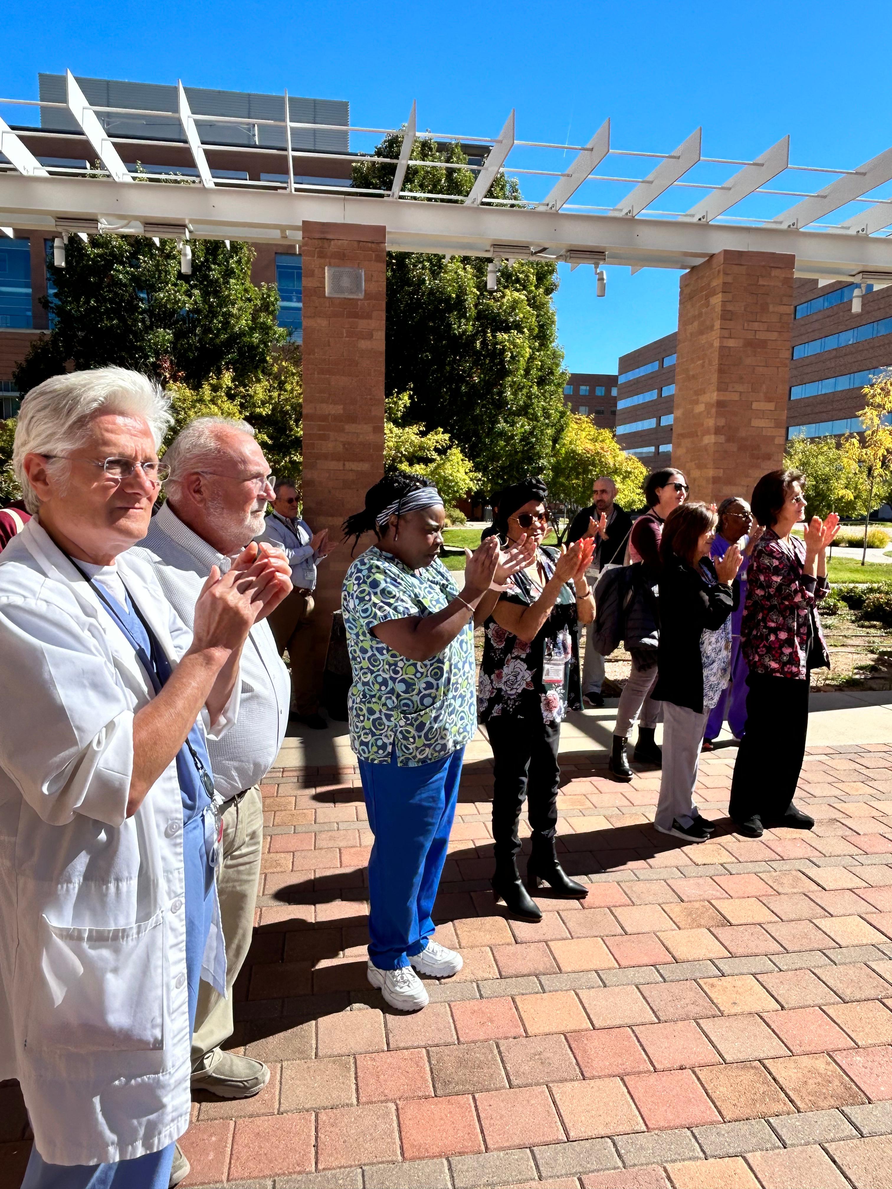 CU Dental faculty and staff applauding