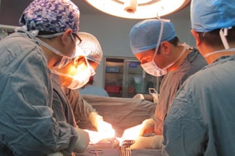 Dr. Edil in surgury (second from right)