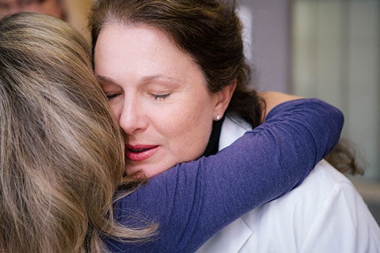 Virginia Borges, MD, and Robin Nash embrace