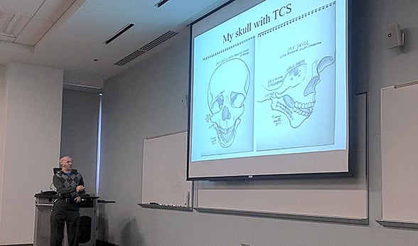 Francis Smith displays his skull drawings on a projector