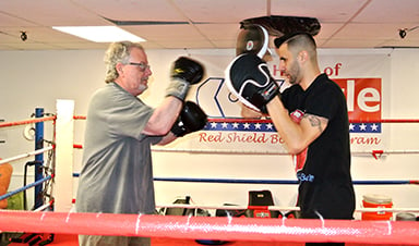 Anthony Mora teaches boxing in Denver