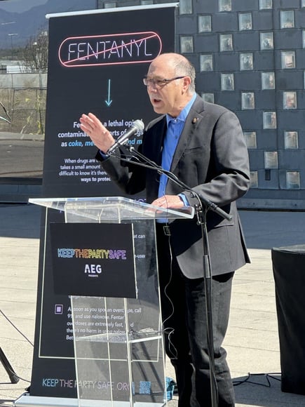 Jose Esquibel speaks to a crowd at a fentanyl awareness event.