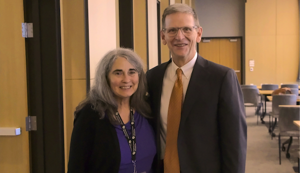 McIntyre and Elizabeth Kovacs smile for a picture
