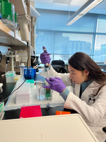 Mi-Hyun Nam, PhD, working in a lab.