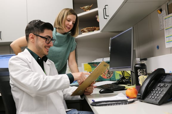 Nick Perez works with Dr. Leah Fitzgerald at the Denver Indian Health and Family Services Clinic during a rotation.