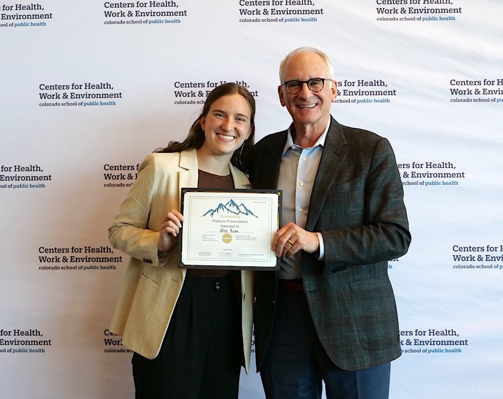 Allie Kom receives the platform presentation. 