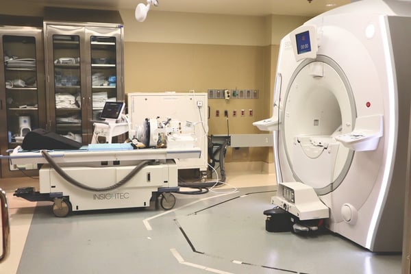 An image of the large devices used to perform a high-intensity focused ultrasound, which involves a large MRI machine.