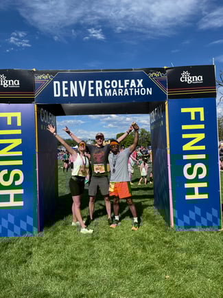 Josiah Shaw and two friends at the finish line of the Colfax Half Marathon.