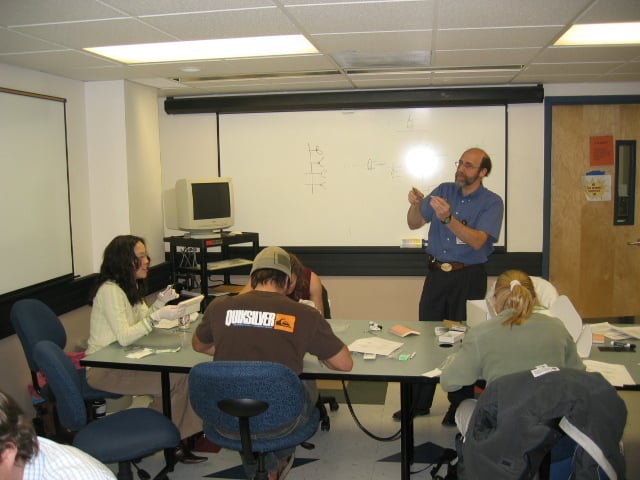 Dr. Deutchman teaches a suture lab in a classroom.