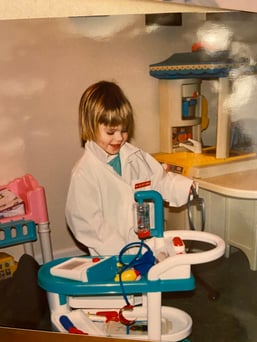 A child plays with a toy doctor set.