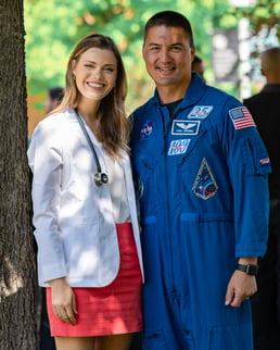 Kines poses for a photo with astronaut Kjell Lindgren.