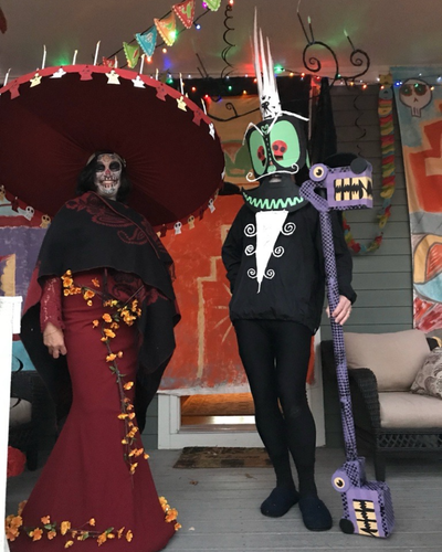 Dr. Shille and his wife dress up for halloween on their porch