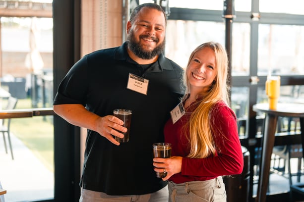 Smiling students at a CU Pharmacy alumni event.