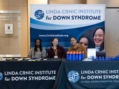 Crnic Institute team members smiling at a booth