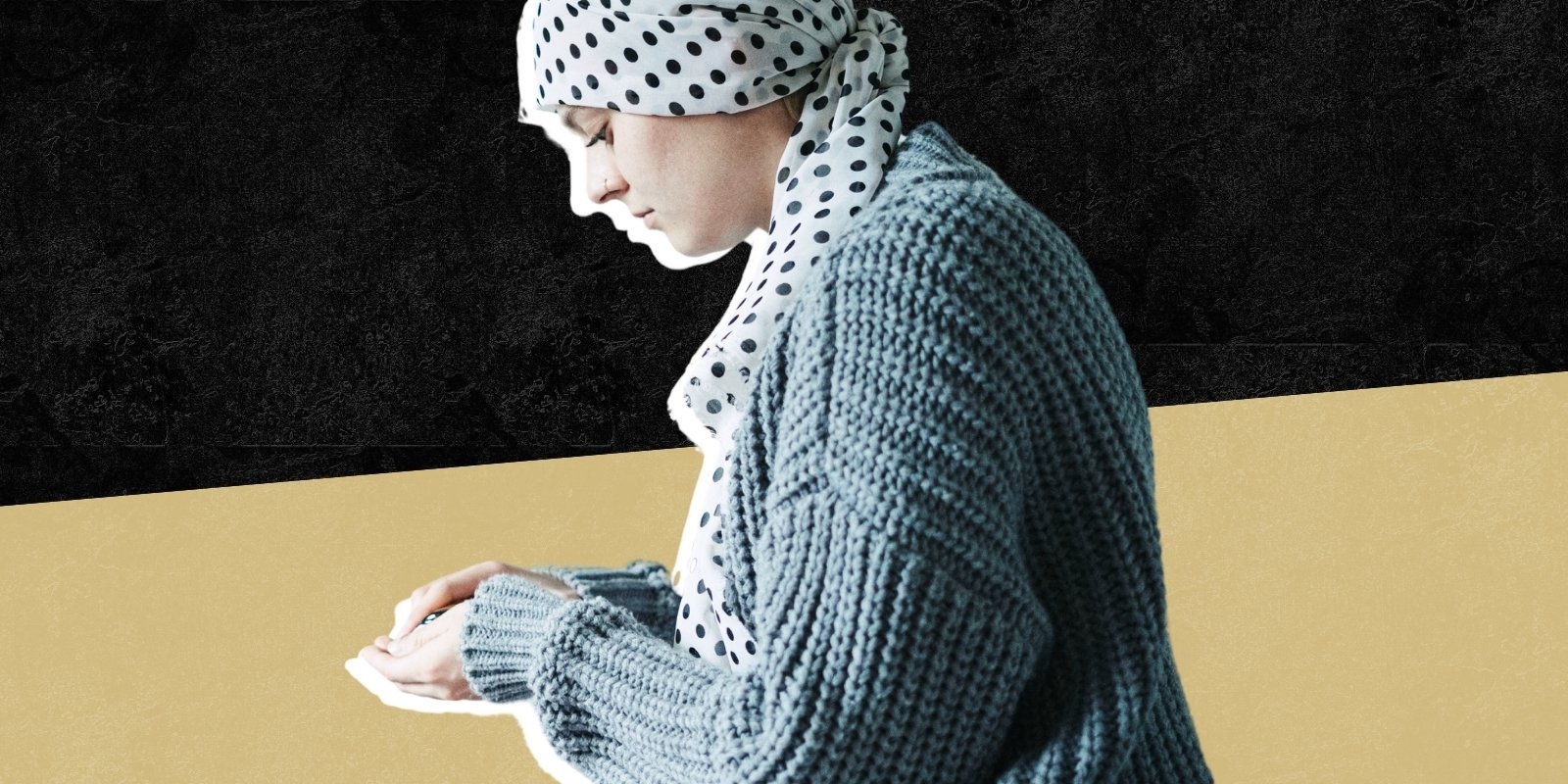 A cancer patient wears a head wrap, sitting with hands folded in front of a black and gold background.