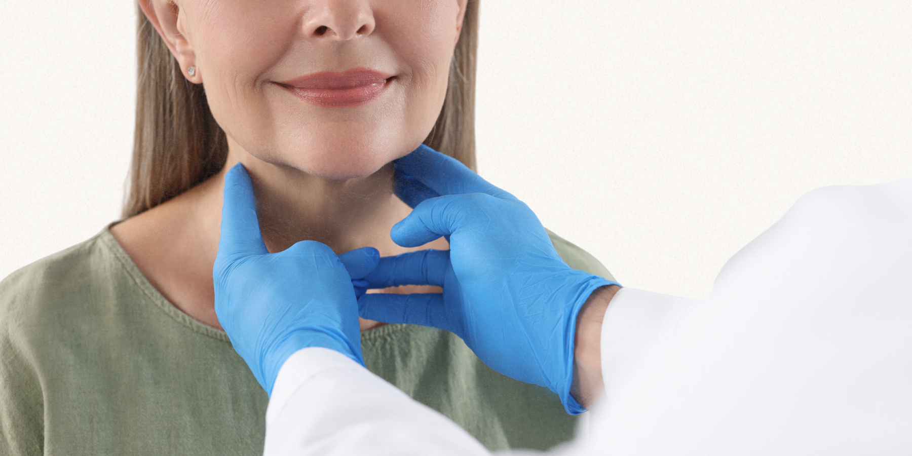A woman has her thyroid gland checked.