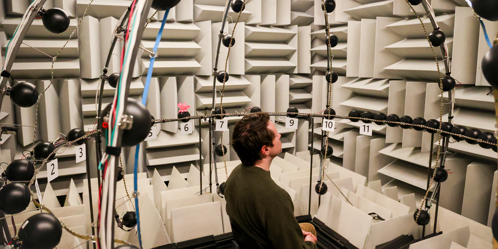 A man sits in the engineered acoustic therapy room at the University of Colorado Anschutz