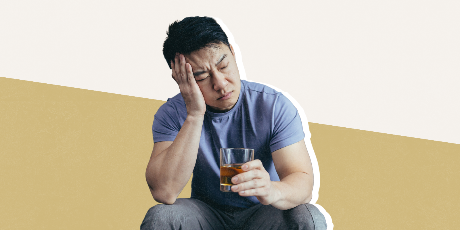 Photo of a man with a glass of alcohol.