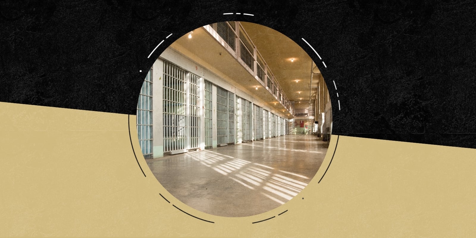 Photo of the inside of a jail with a row of jail cells
