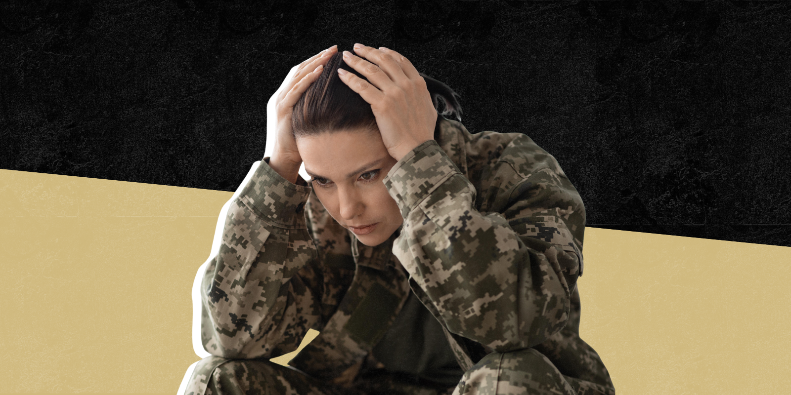 Photo of person in the military with hands on head looking stressed 