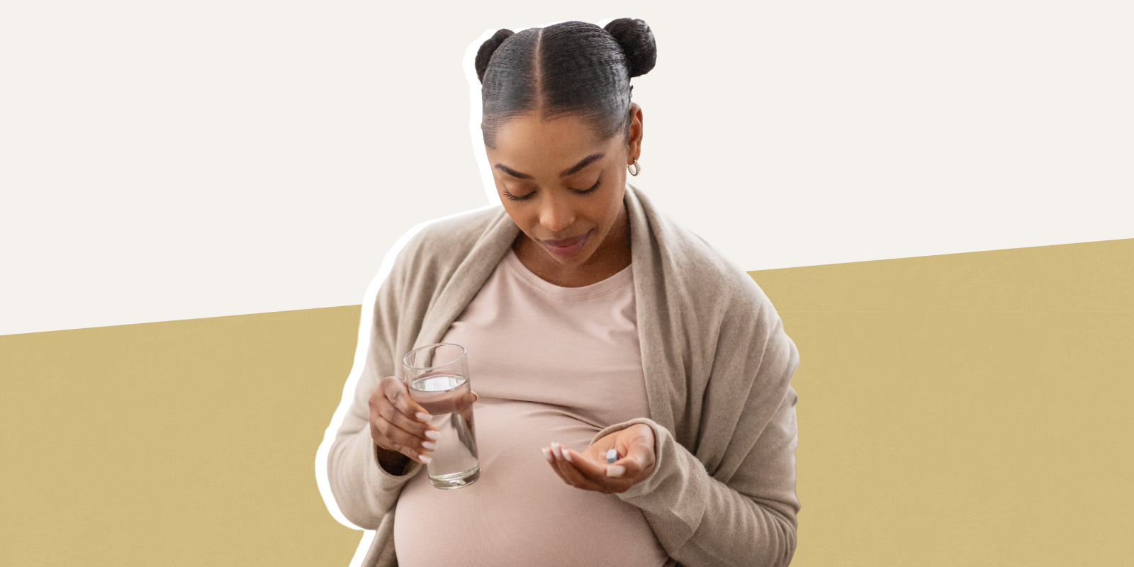 Photo of pregnant woman with bottle of supplements