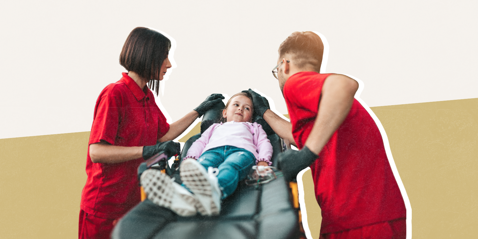 Photo of child being treated by medical professionals 