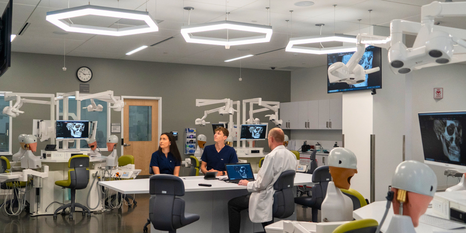 students and faculty in dental advanced simulation hub