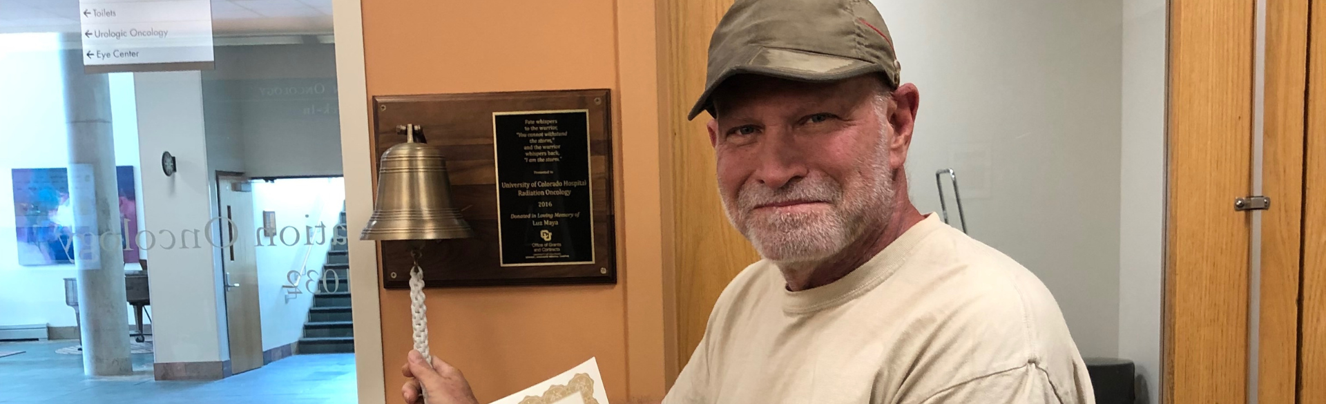 Anthony Seniw rings the bell after completing treatment at the CU Cancer Center.