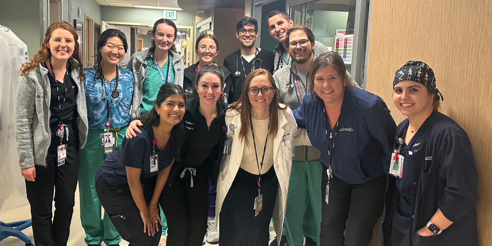  Chief resident Ally Fuher, MD (lower row, in white coat) along with this month’s residents, fellows, and nurses in the medical Intensive care unit at UCHealth University of Colorado Hospital. 