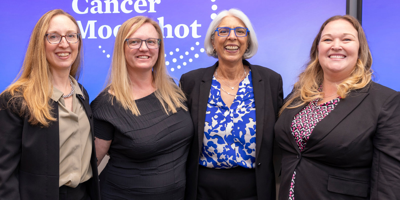 Andrea (Andi) Dwyer (left) poses with Arati Prabhakar, PhD,  director of the White House Office of Science and Technology Policy