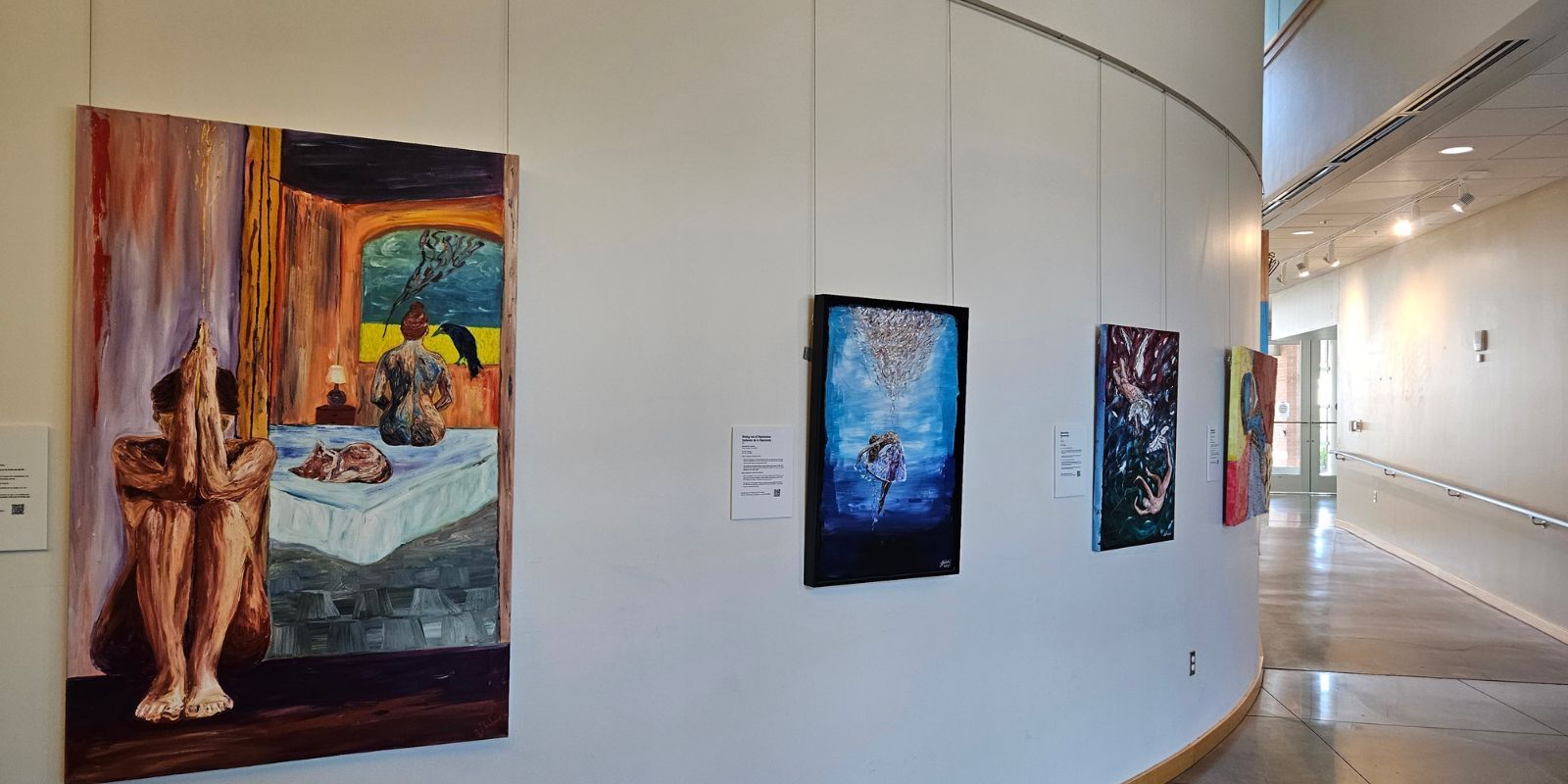 4 colorful painting on a rounded wall