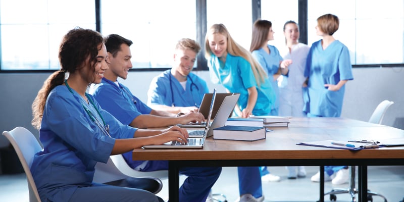nursing students around a table
