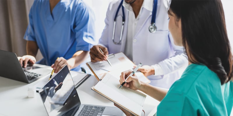three researchers around a table