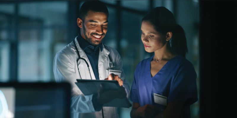 nurse and doctor talking together