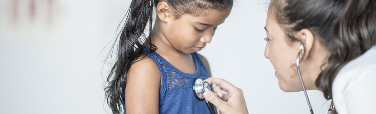 Young girl with stethoscope on chest