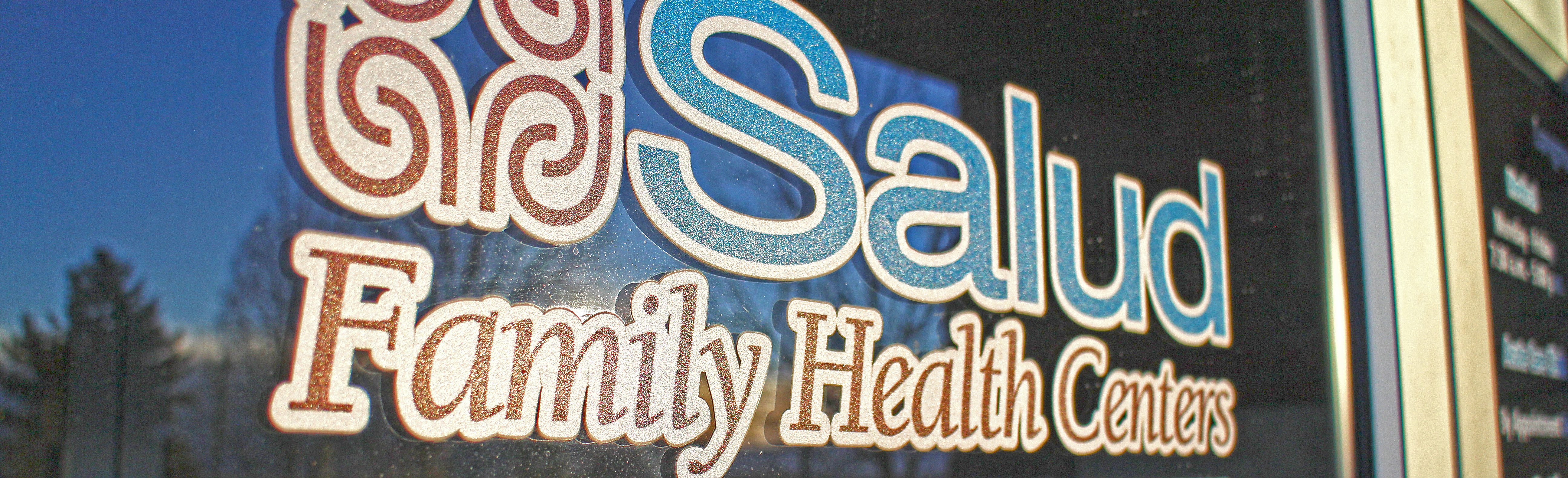 Sign on Salud Family Health Centers door