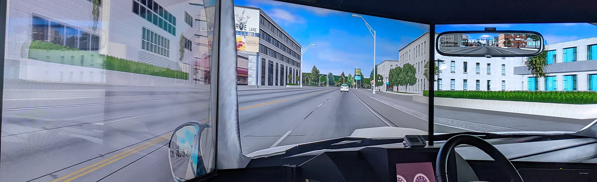 View of road and buildings from a driving simulator