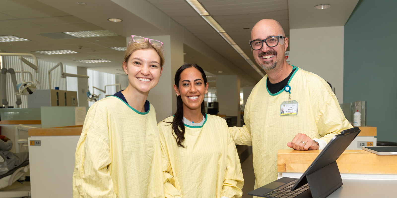 students and faculty in dental clinic