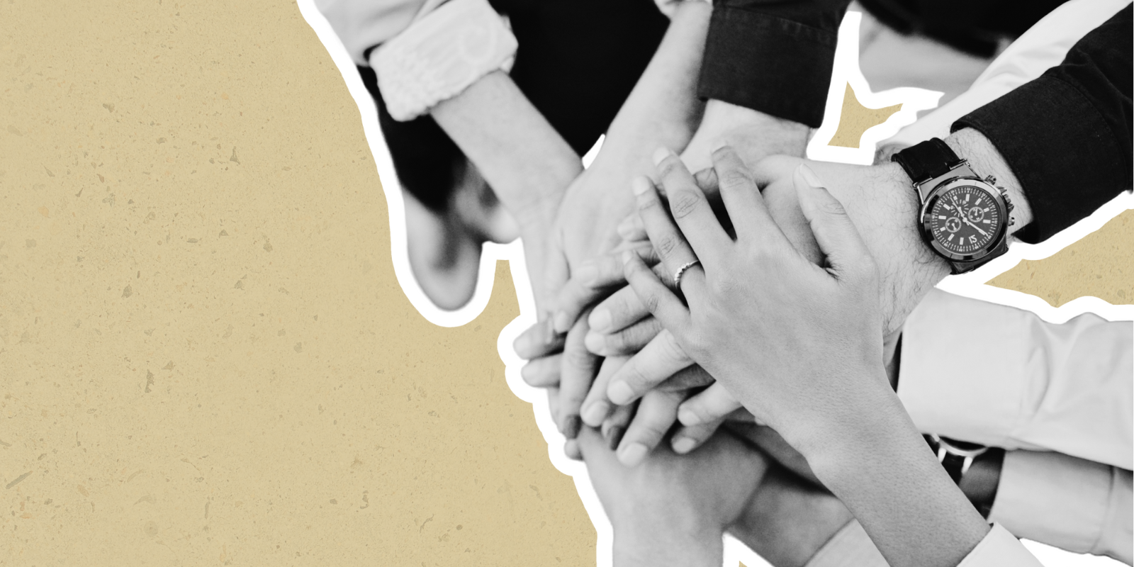 Hands of multiple people stacked on top of each other demonstrating collaboration among team members