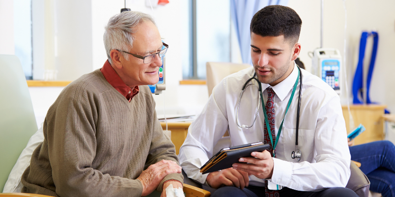 Dr. and patient looking at a screen.