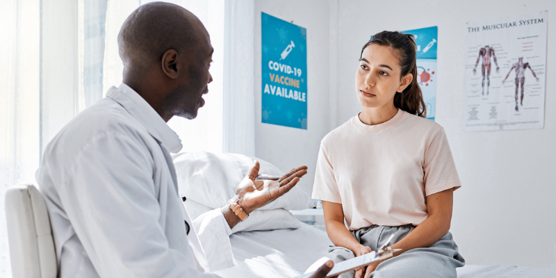 Doctor with patient during a visit.