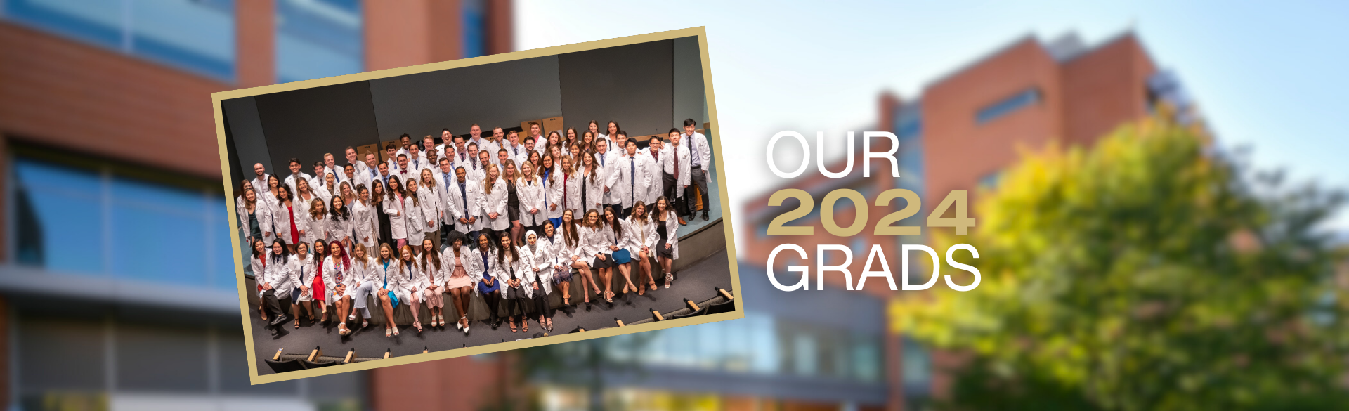 Large group photo of dental students in their white coats with text Our 2024 Grads 