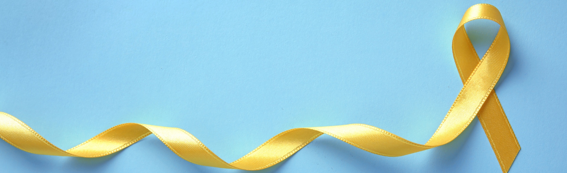 Yellow ribbon on blue background